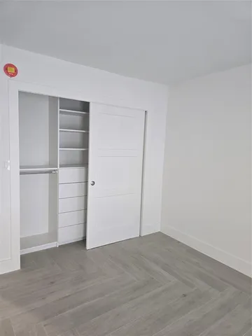a stove top oven sitting inside of a kitchen