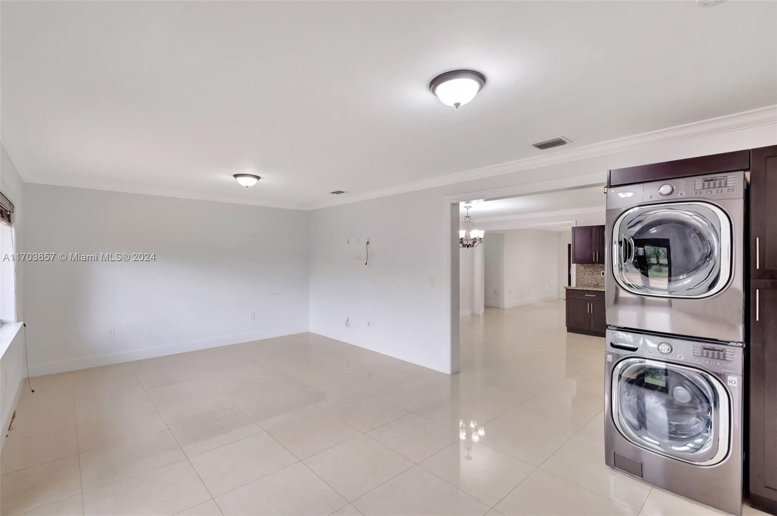 141 Southwest 51st Court, Unit 141 Miami, FL 33134 - Photo 11 of 38 a view of a storage & utility room with washer and dryer