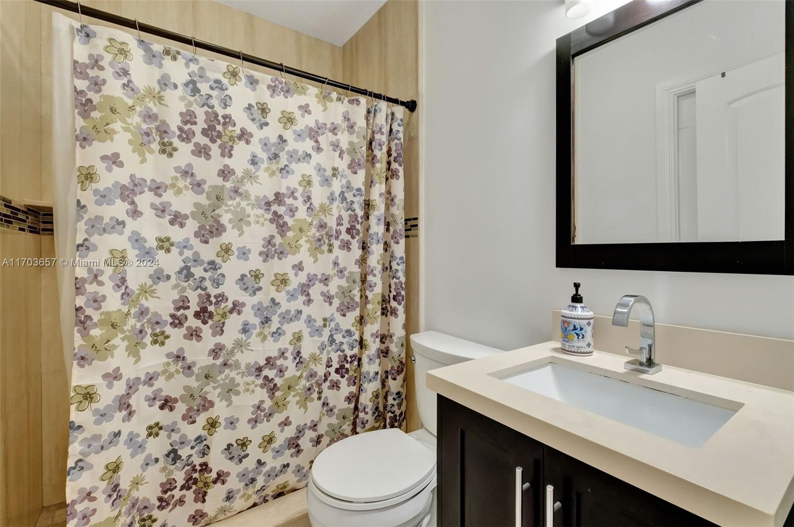 141 Southwest 51st Court, Unit 141 Miami, FL 33134 - Photo 14 of 38 a bathroom with a sink toilet and shower