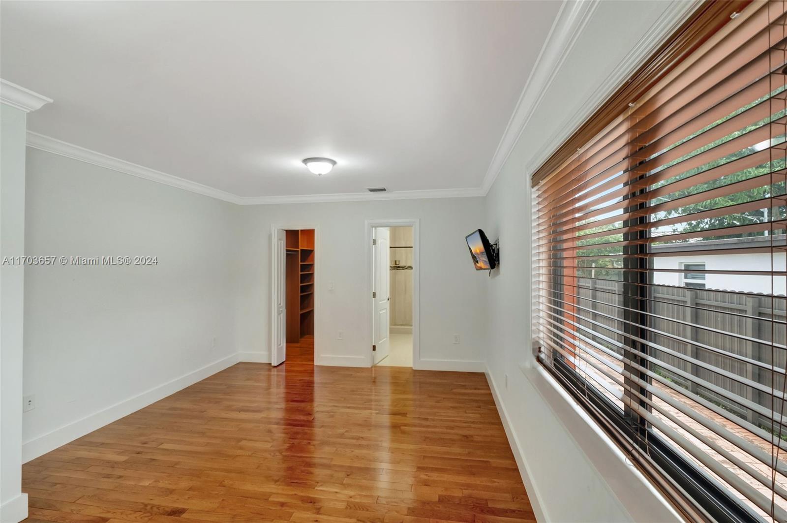 141 Southwest 51st Court, Unit 141 Miami, FL 33134 - Photo 19 of 38 a view of a room with wooden floor and stairs