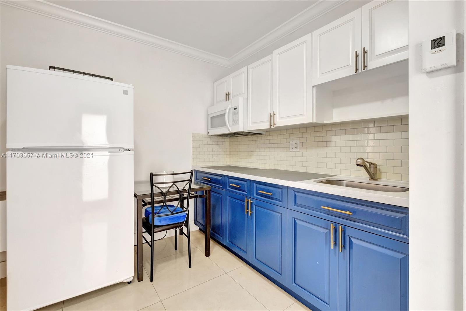 141 Southwest 51st Court, Unit 141 Miami, FL 33134 - Photo 28 of 38 a kitchen with stainless steel appliances granite countertop a refrigerator and a sink
