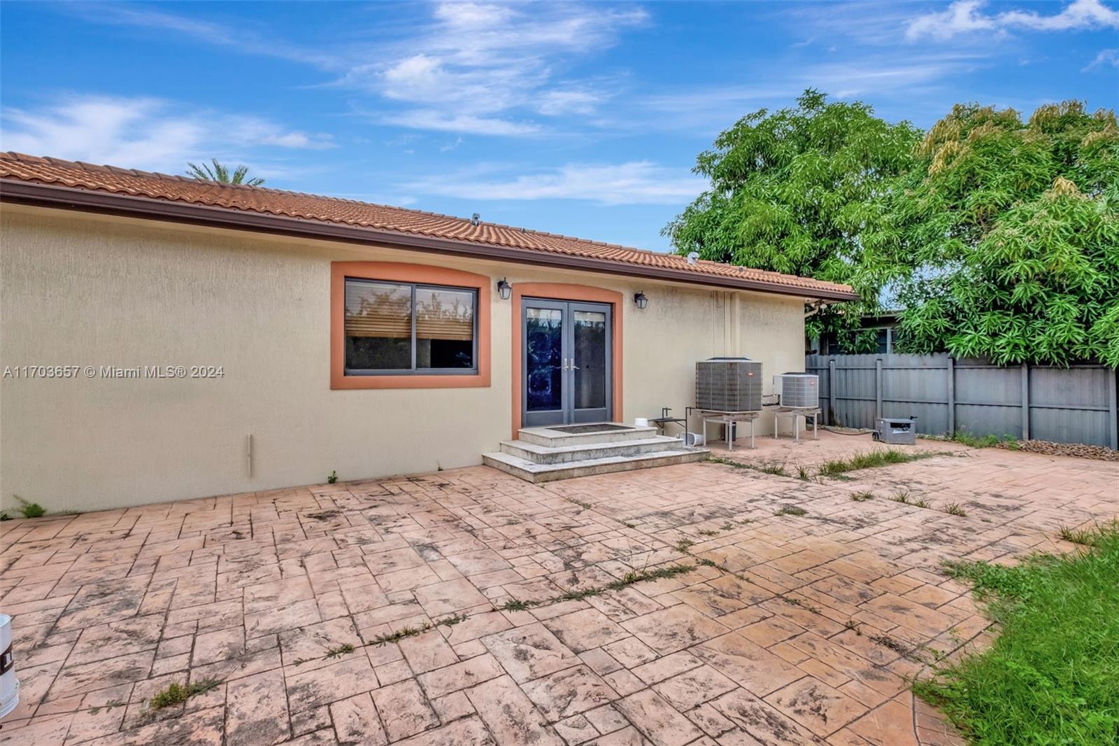 141 Southwest 51st Court, Unit 141 Miami, FL 33134 - Photo 37 of 38 a front view of a house with a garden