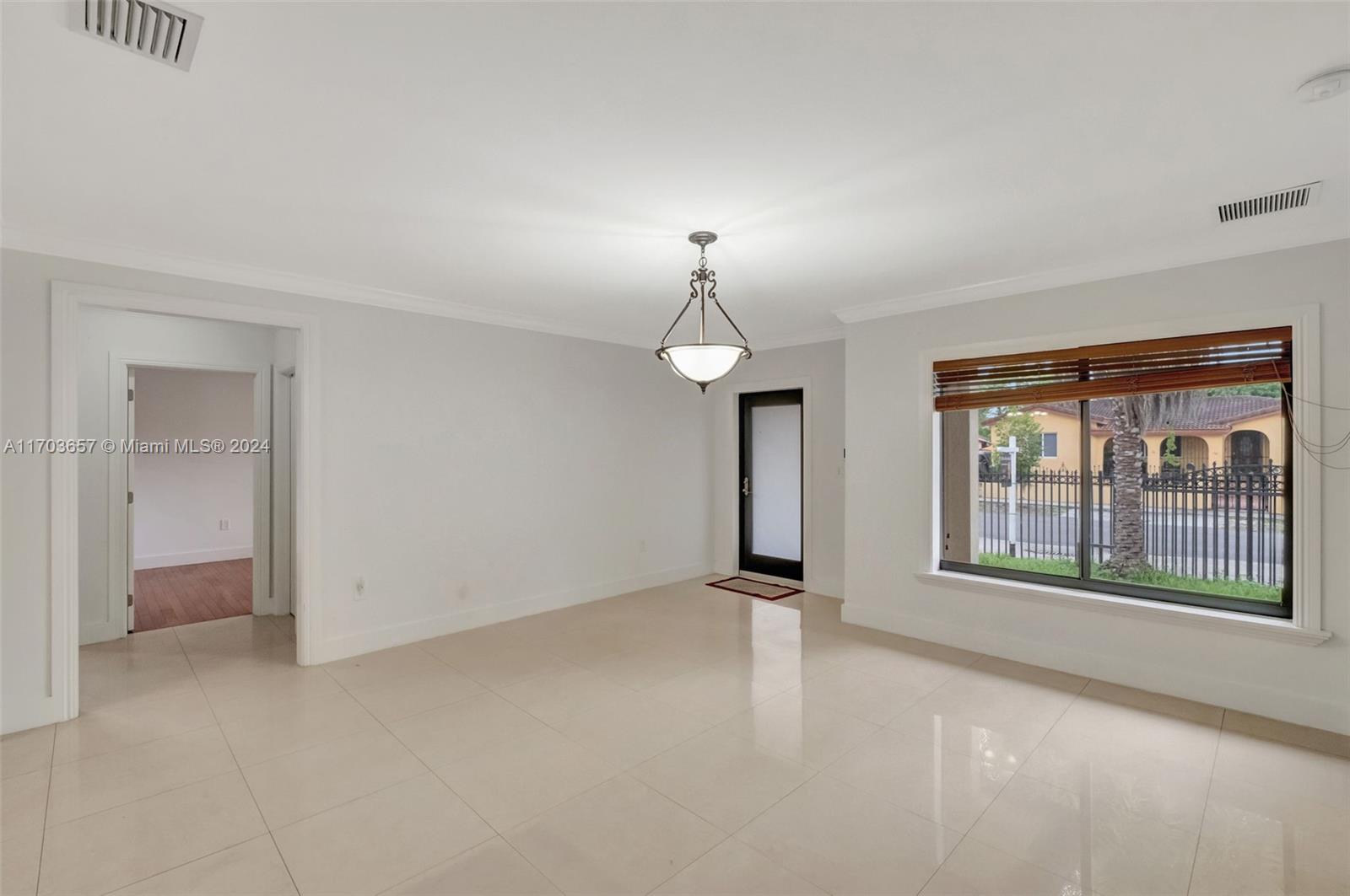 141 Southwest 51st Court, Unit 141 Miami, FL 33134 - Photo 4 of 38 a view of an empty room with a window