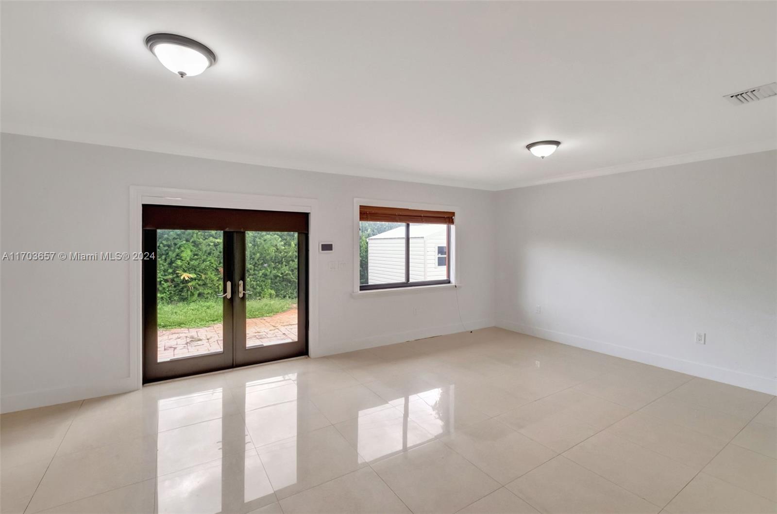 141 Southwest 51st Court, Unit 141 Miami, FL 33134 - Photo 10 of 38 an empty room with windows and view