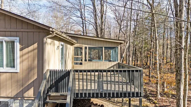 a bedroom with furniture window and a chandelier