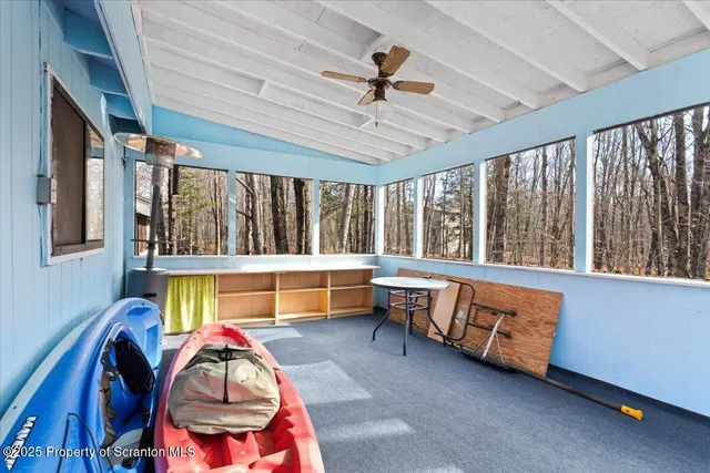 a view of a bedroom with a large bed and a window