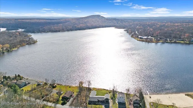 an aerial view of residential building with ocean view