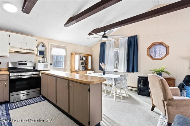 a kitchen with a stove and a refrigerator