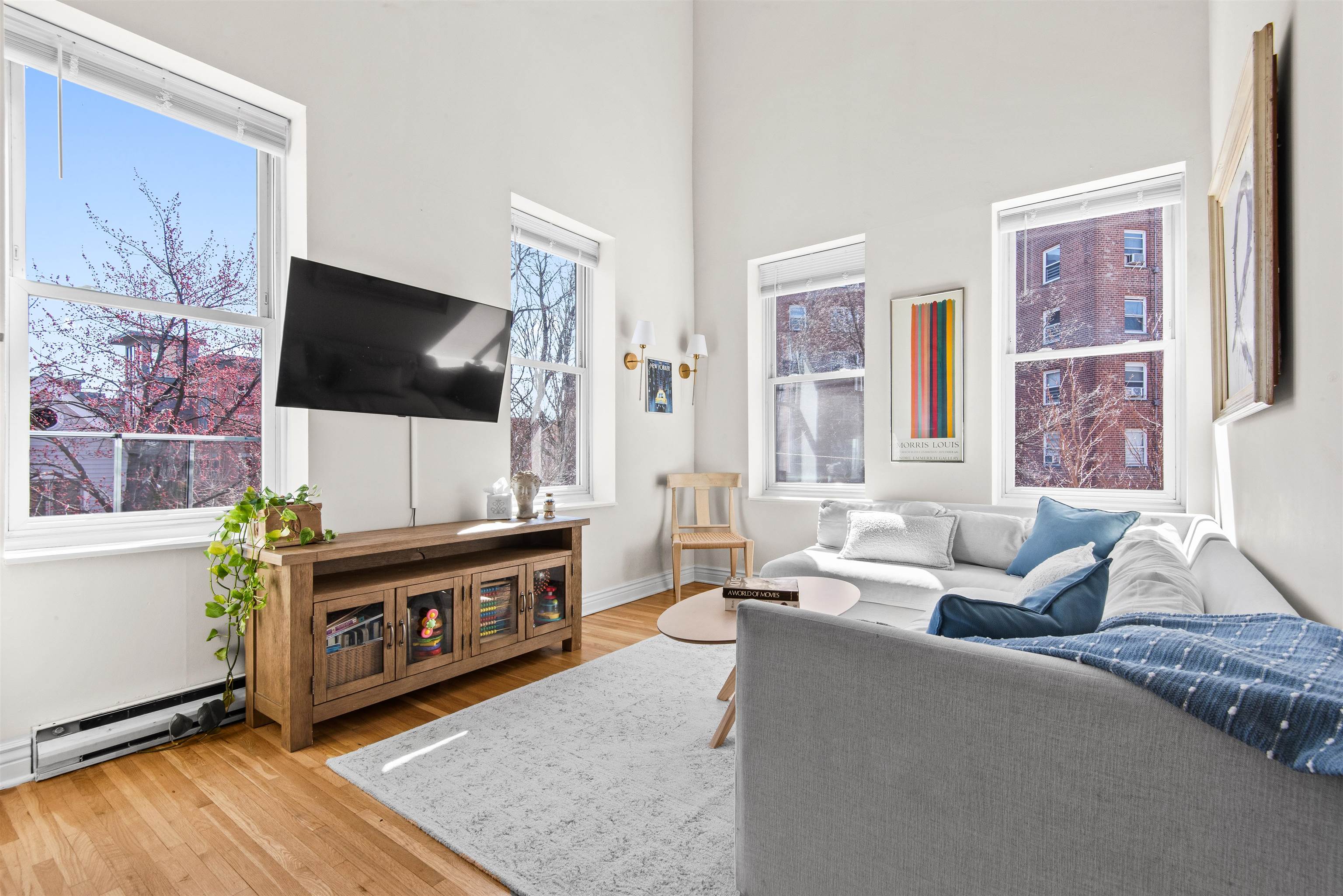 456 9th Street, Unit 9 Hoboken, NJ 07030 - Photo 11 of 29 a living room with furniture and a flat screen tv