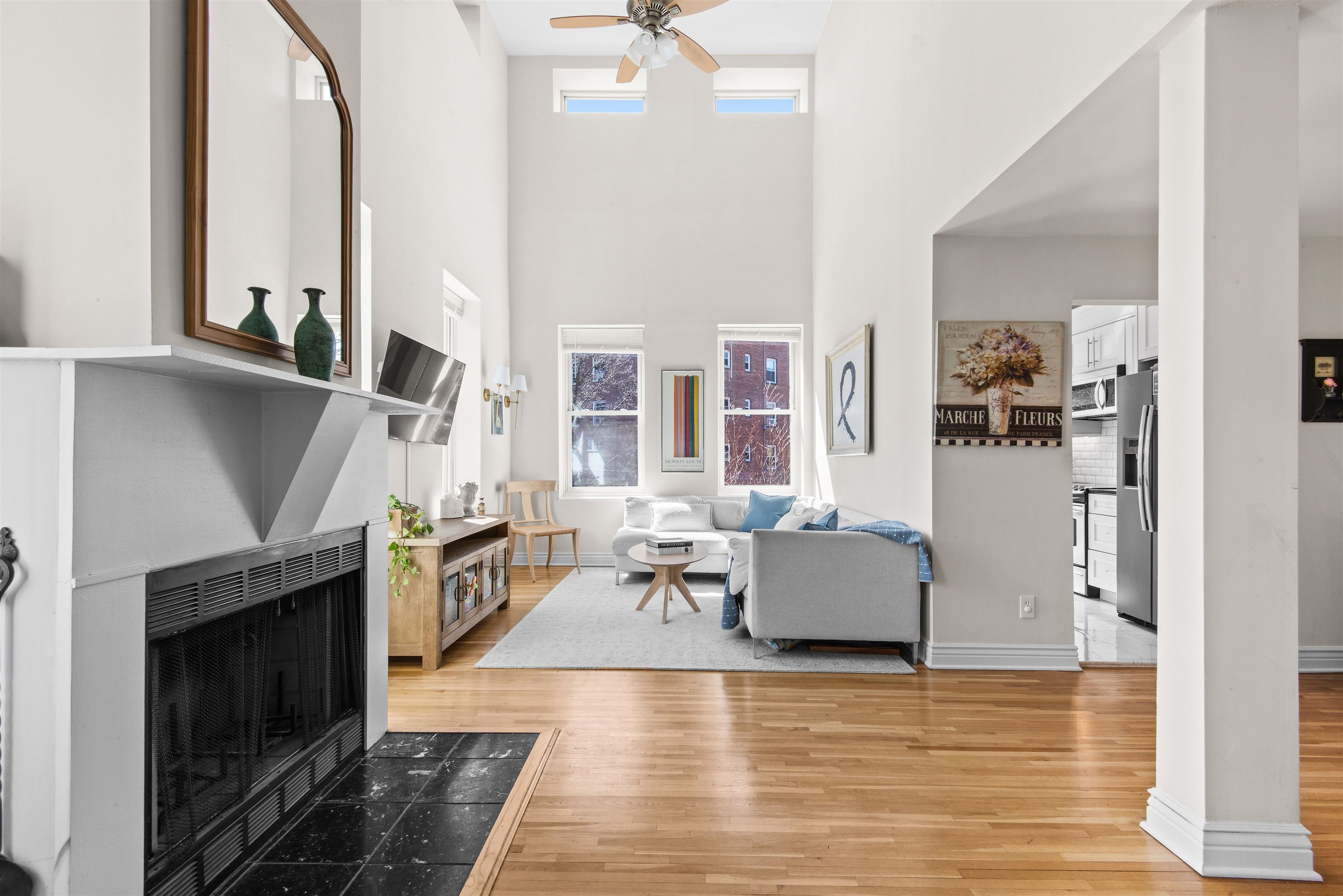 456 9th Street, Unit 9 Hoboken, NJ 07030 - Photo 12 of 29 a living room with furniture and a fireplace