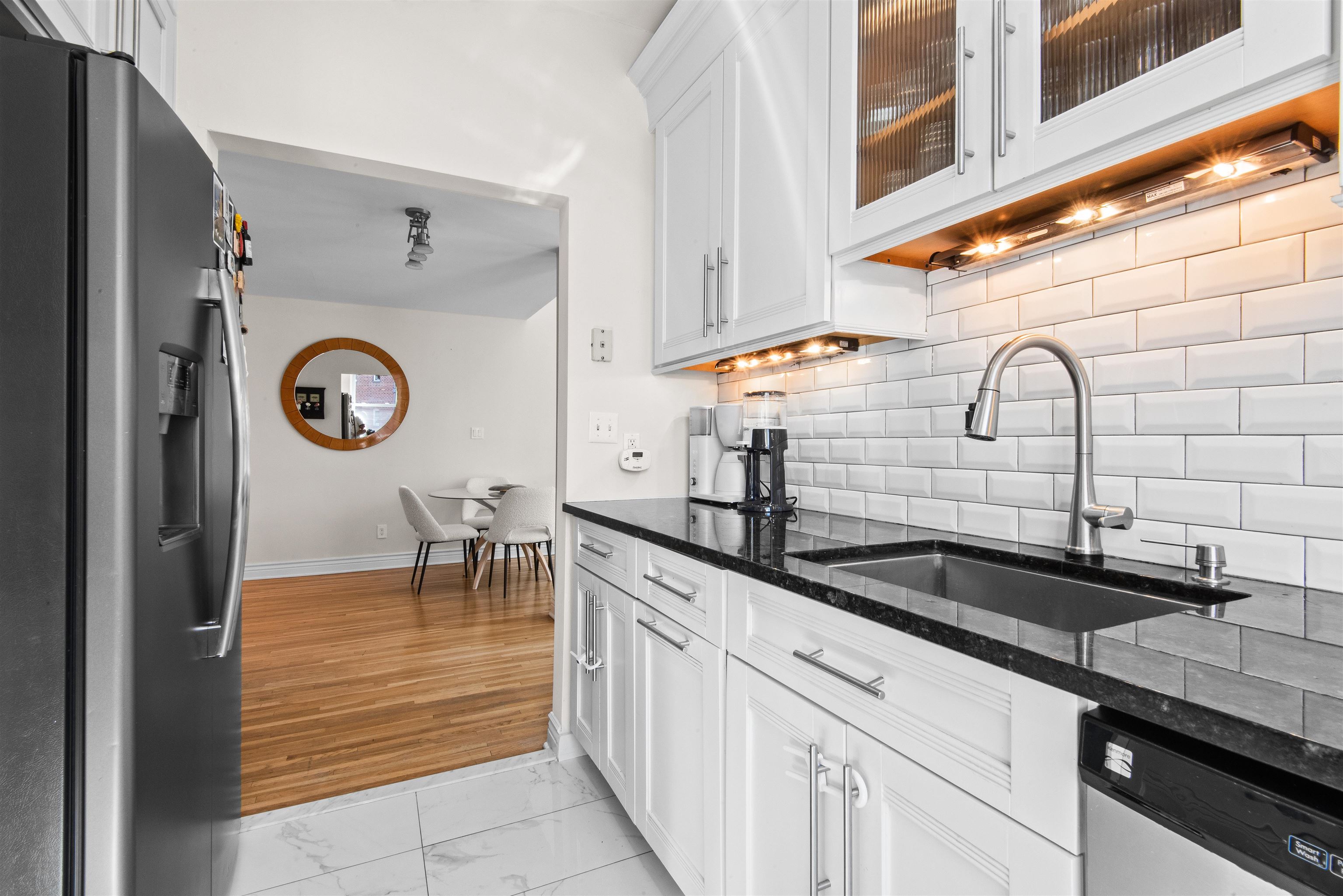 456 9th Street, Unit 9 Hoboken, NJ 07030 - Photo 14 of 29 a kitchen with a sink and a cabinets