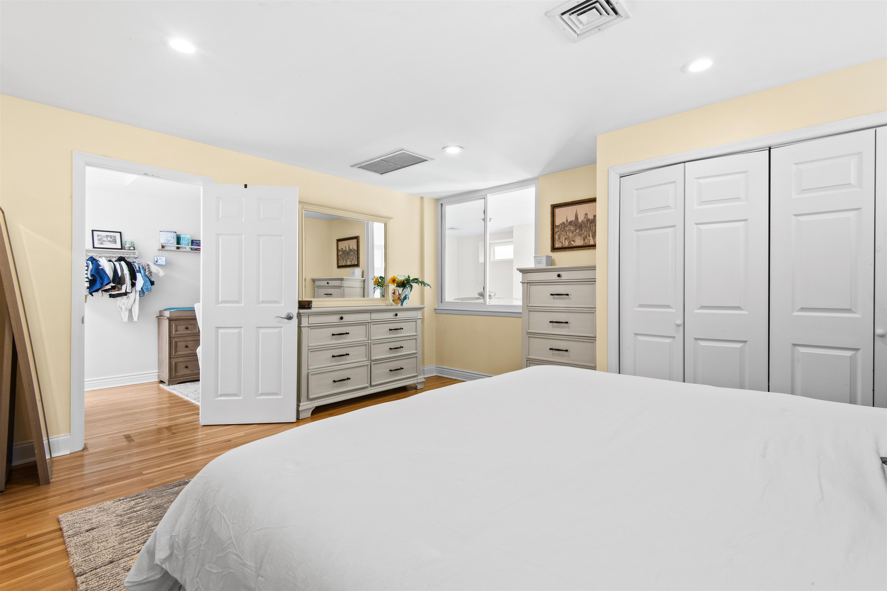 456 9th Street, Unit 9 Hoboken, NJ 07030 - Photo 18 of 29 a spacious bedroom with a bed and a cabinets