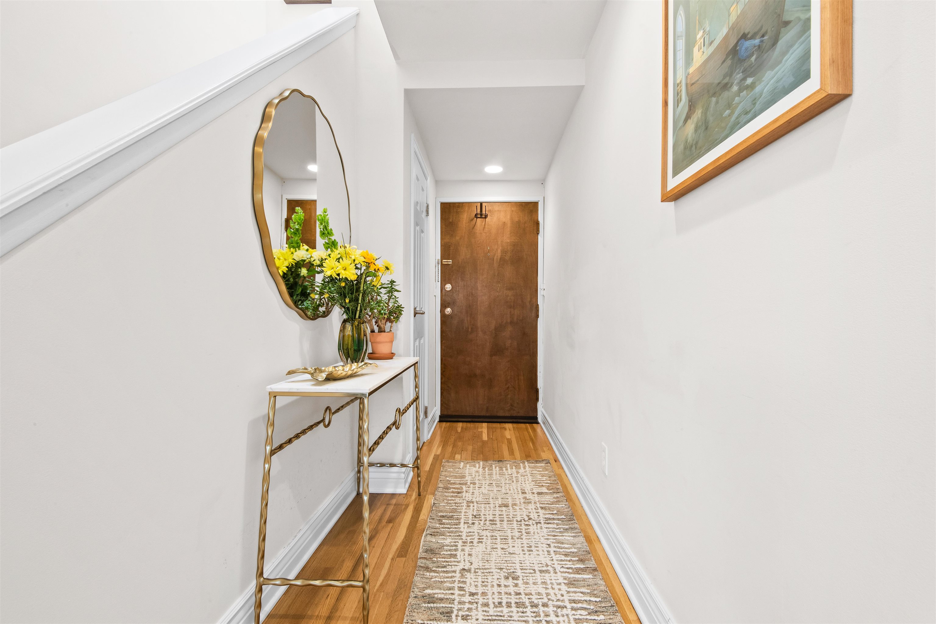 456 9th Street, Unit 9 Hoboken, NJ 07030 - Photo 22 of 29 a view of a hallway with wooden floor and a potted plant