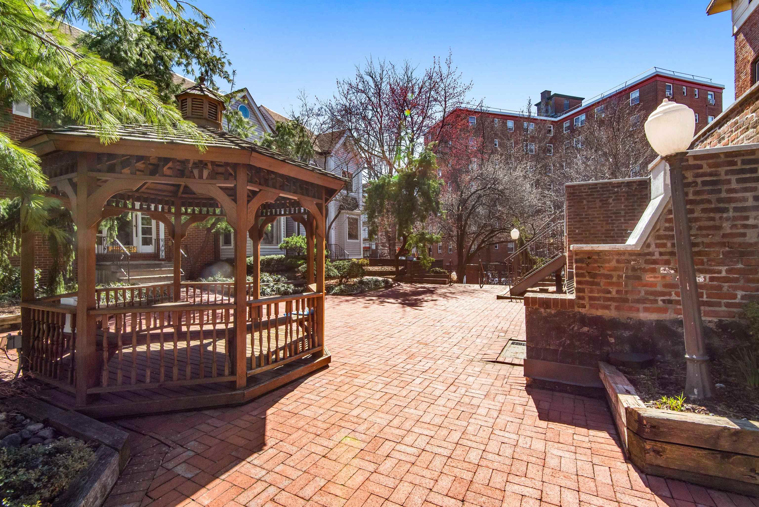 456 9th Street, Unit 9 Hoboken, NJ 07030 - Photo 26 of 29 a view of a house with a yard