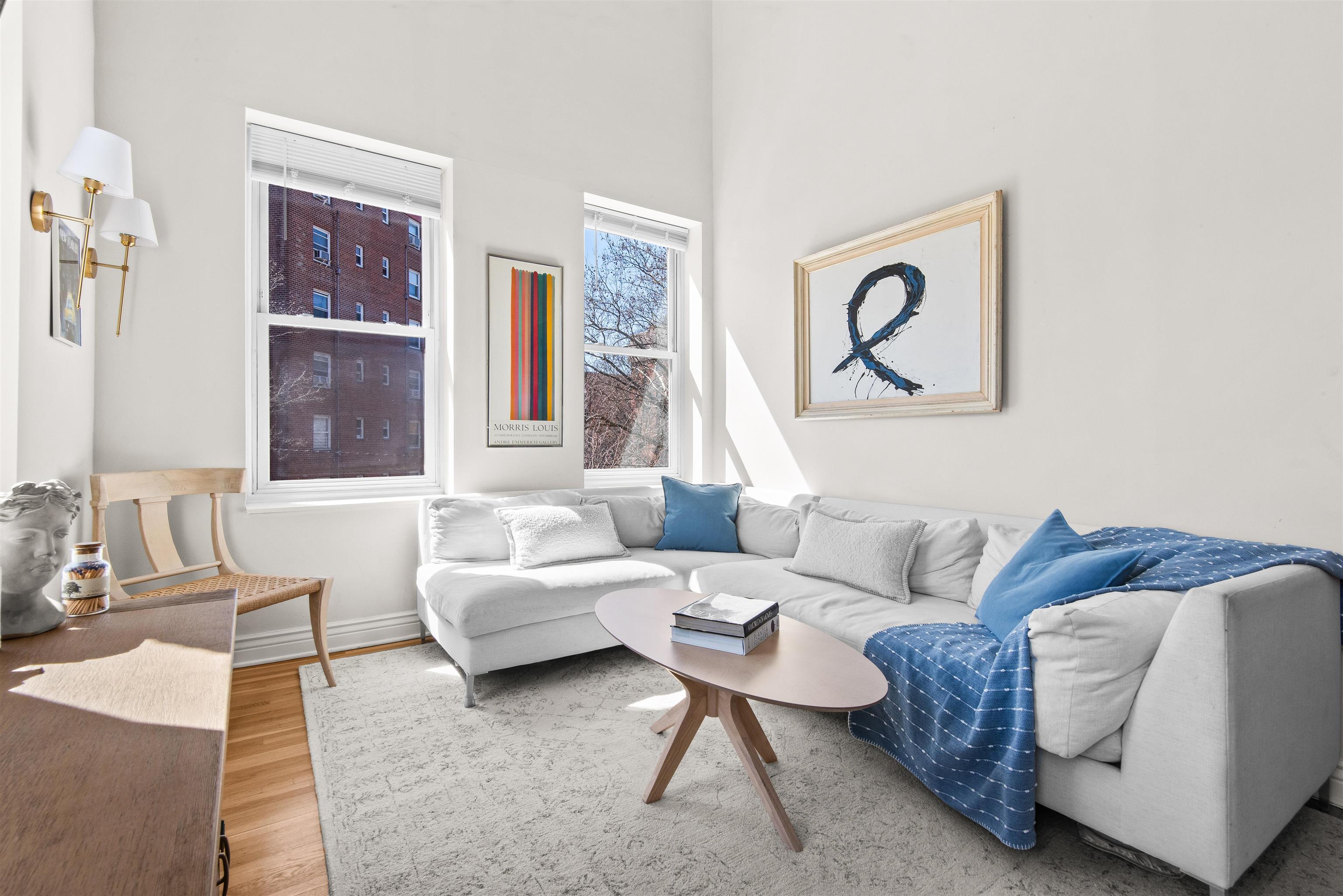 456 9th Street, Unit 9 Hoboken, NJ 07030 - Photo 7 of 29 a living room with furniture and a window