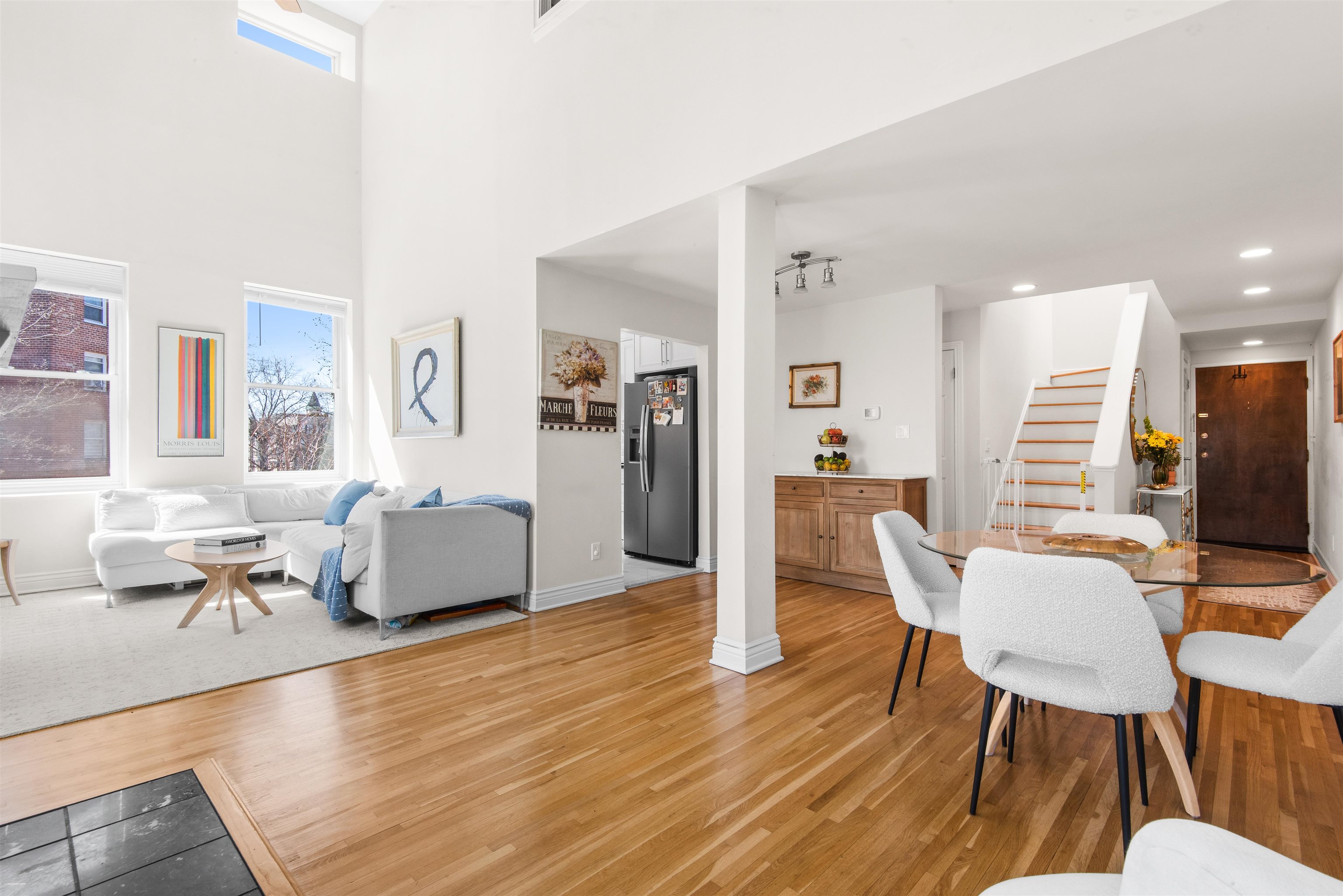456 9th Street, Unit 9 Hoboken, NJ 07030 - Photo 8 of 29 a living room with furniture dining table and wooden floor