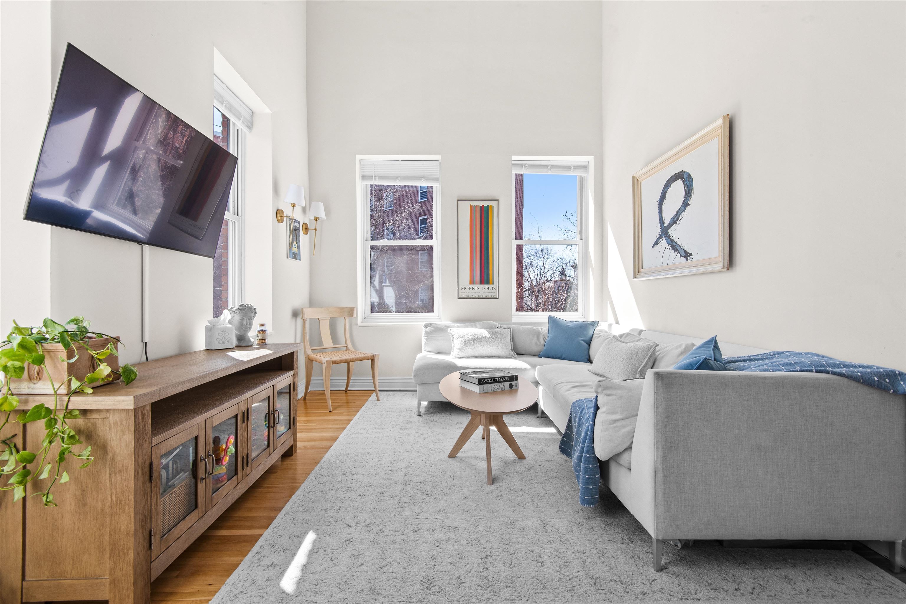 456 9th Street, Unit 9 Hoboken, NJ 07030 - Photo 10 of 29 a living room with furniture and a table