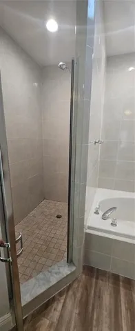 a white toilet sitting next to a white sink