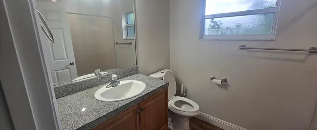 a view of a living room with furniture and a window