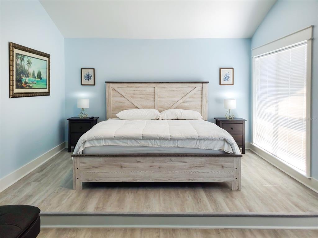 215 Medallion Boulevard, Unit G Madeira Beach, FL 33708 - Photo 14 of 29 a bedroom with a bed and a window