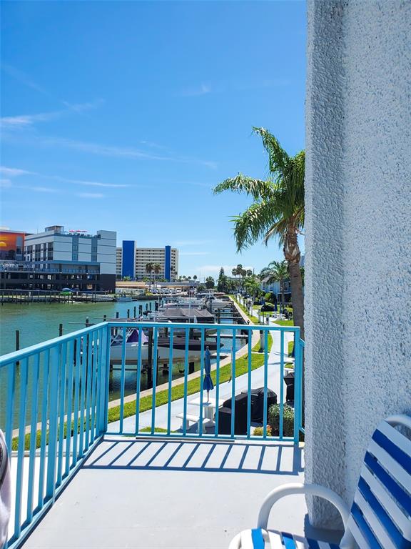 215 Medallion Boulevard, Unit G Madeira Beach, FL 33708 - Photo 23 of 29 a view of a balcony with city view