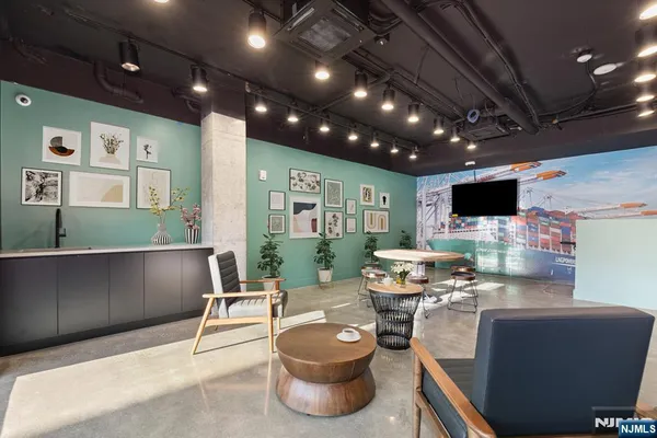 a view of a hall with furniture and a garage