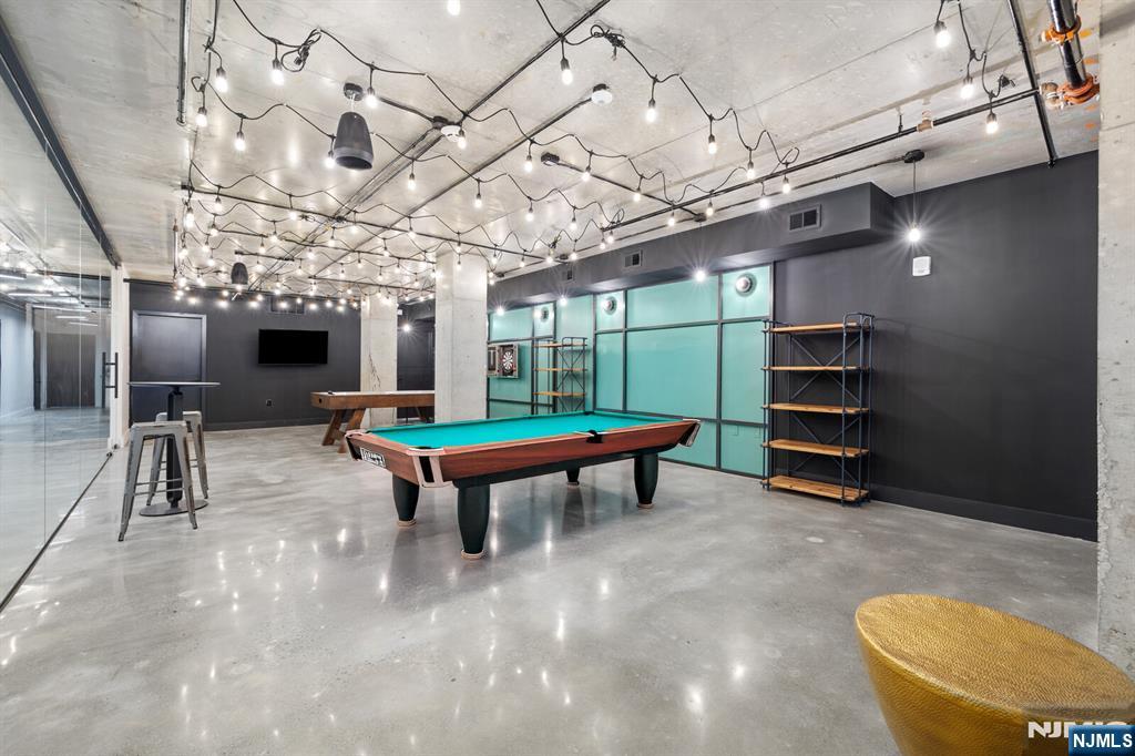 65 McWhorter Street, Unit 711 Newark, NJ 07105 - Photo 13 of 14 a room with pool tables and windows