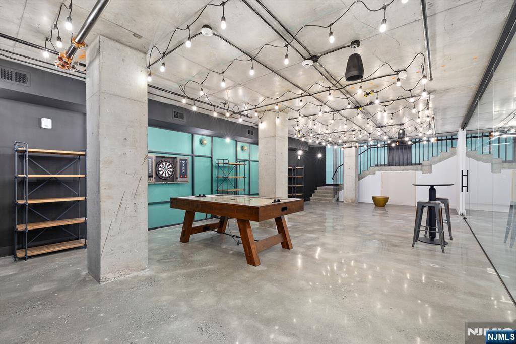 65 McWhorter Street, Unit 711 Newark, NJ 07105 - Photo 14 of 14 a view of a hall with furniture and a garage