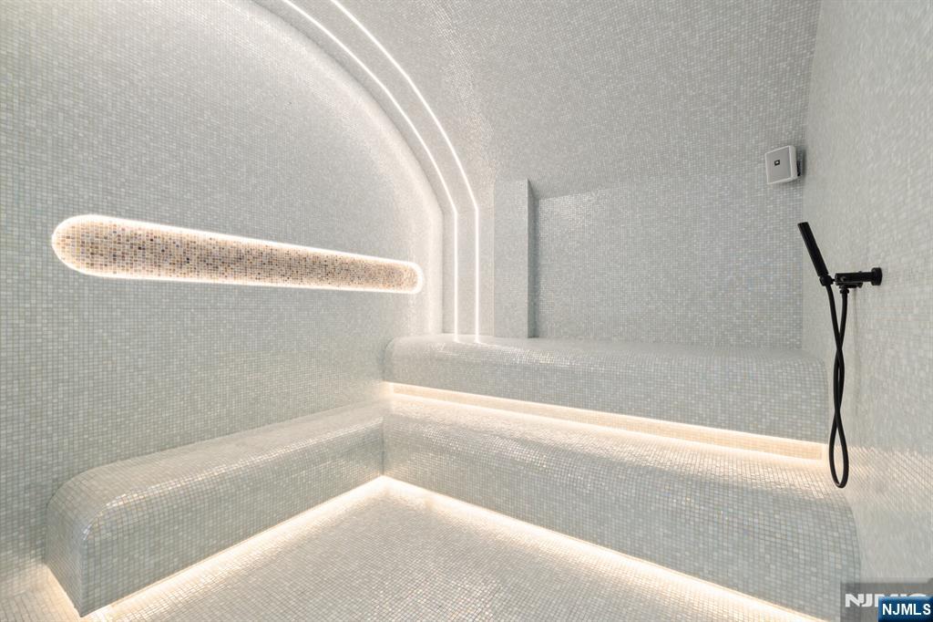 65 McWhorter Street, Unit 711 Newark, NJ 07105 - Photo 5 of 14 a bathroom with a bathtub