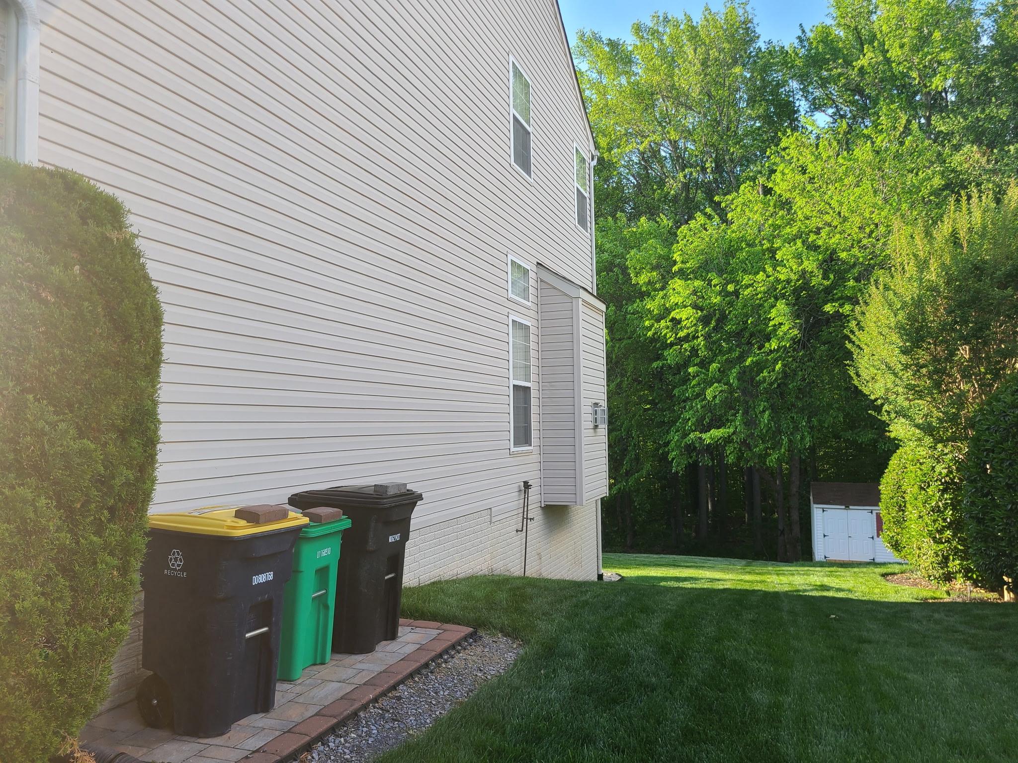 1202 Strausberg Street Accokeek, MD 20607 - Photo 6 of 43 Lush greenery frames a serene side / backyard.
