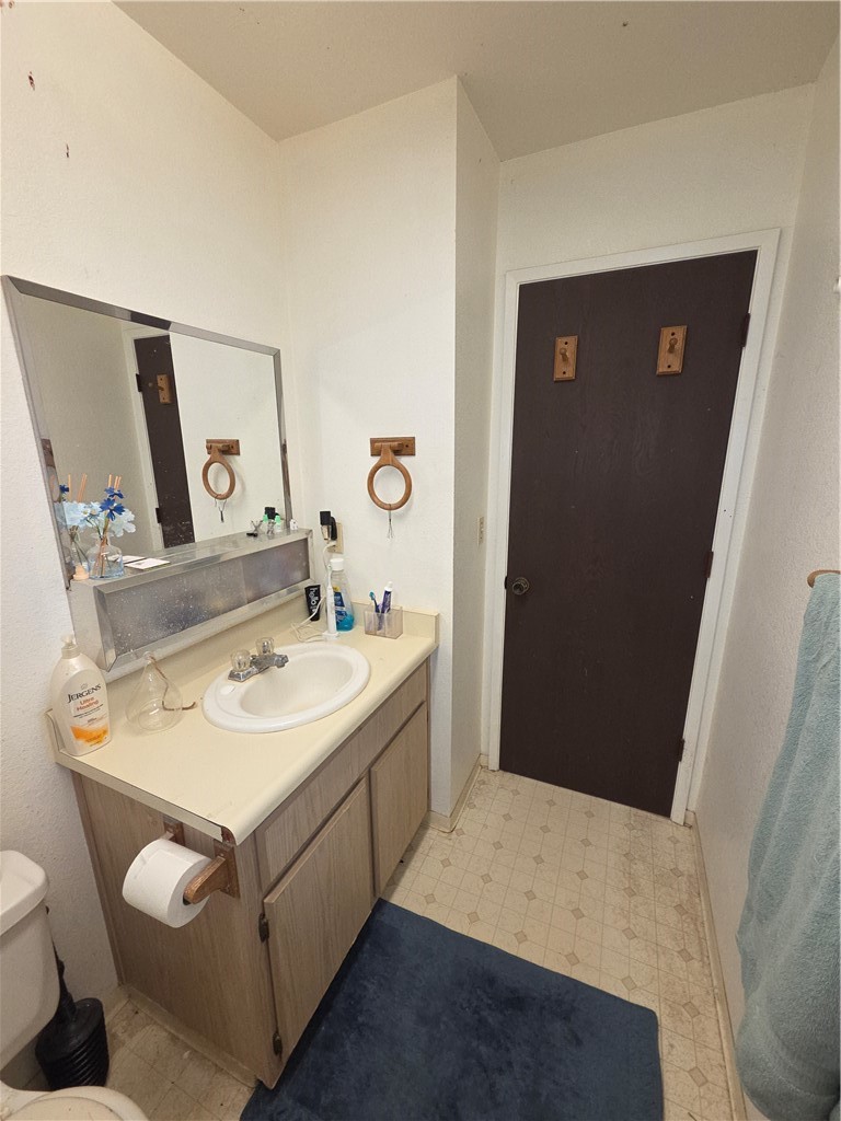 635 North Street Corning, CA 96021 - Photo 15 of 29 a bathroom with a sink and a mirror