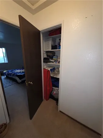 a kitchen with a refrigerator and a stove