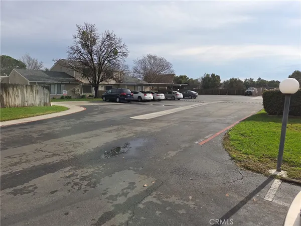 a view of street with parked cars