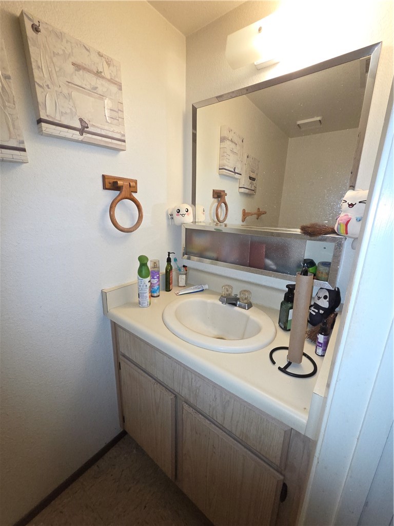 635 North Street Corning, CA 96021 - Photo 7 of 29 a bathroom with a sink and a mirror