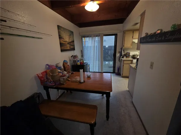 a dining room with furniture and window