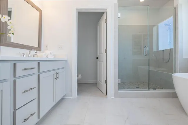 a bathroom with a shower and a sink