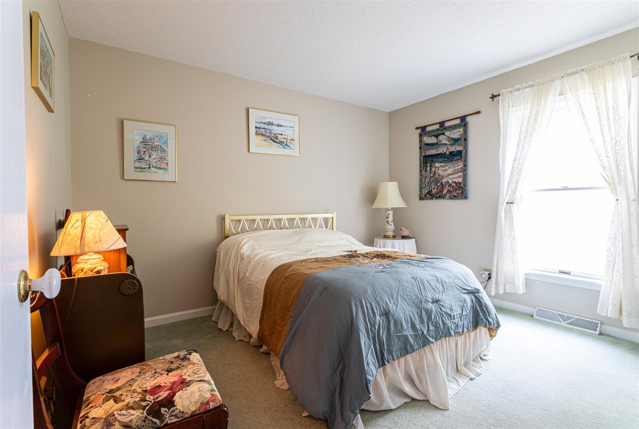 12 Pinewood Road Cape May, NJ 08204 - Photo 9 of 22 a bedroom with a bed and a window