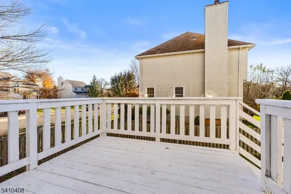 a view of a balcony with wooden floor