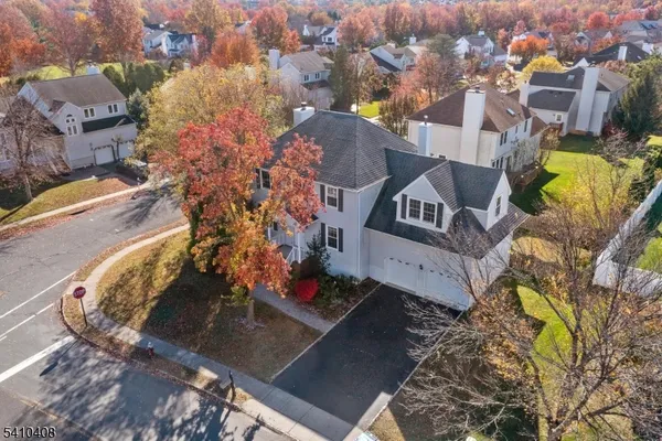 an aerial view of a house with a swimming pool