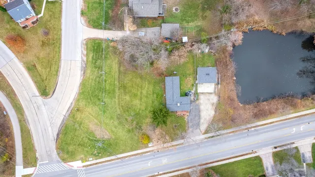 an aerial view of residential houses with outdoor space
