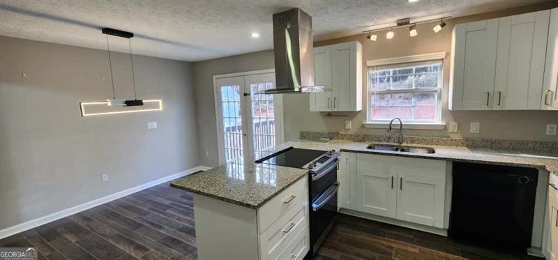 4872 Lewis Road Powder Springs, GA 30127 - Photo 11 of 42 a kitchen with granite countertop a sink and cabinets