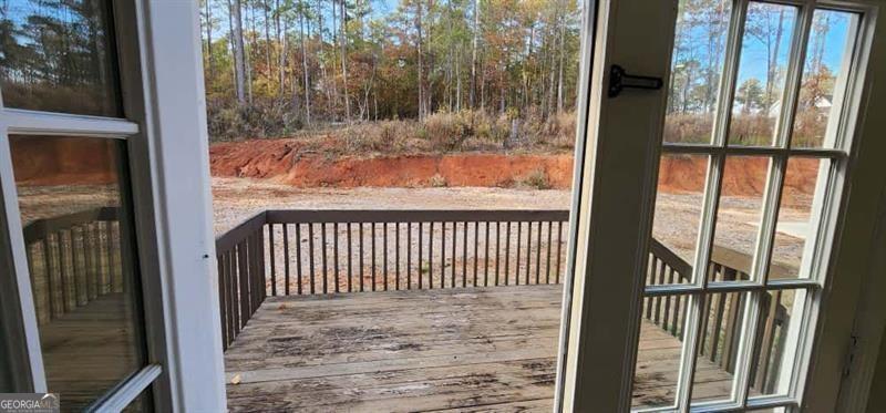 4872 Lewis Road Powder Springs, GA 30127 - Photo 14 of 42 a view of a porch with a floor to ceiling window