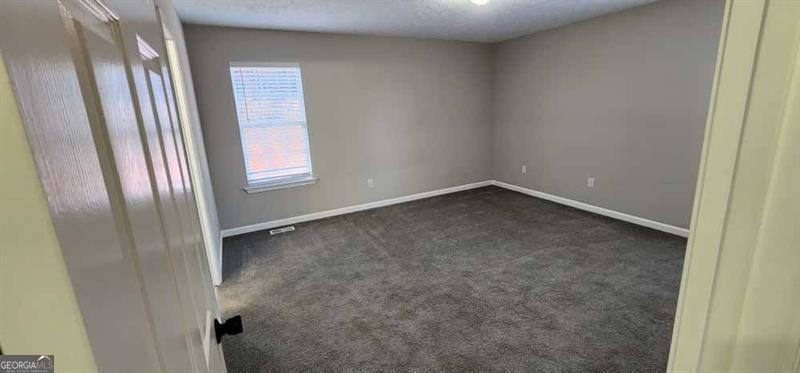 4872 Lewis Road Powder Springs, GA 30127 - Photo 19 of 42 an empty room with windows
