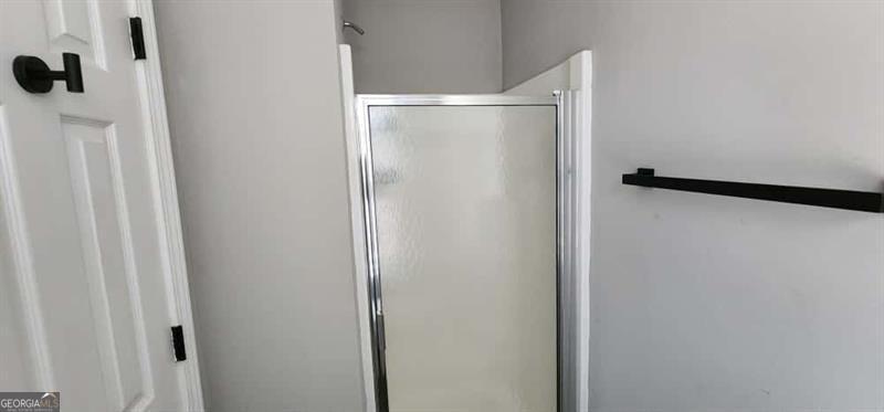 4872 Lewis Road Powder Springs, GA 30127 - Photo 23 of 42 a bathroom with a shower