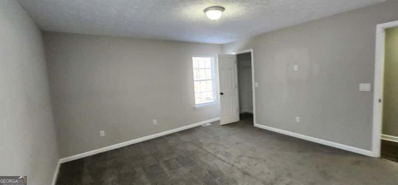 4872 Lewis Road Powder Springs, GA 30127 - Photo 27 of 42 an empty room with windows