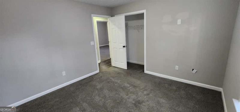 4872 Lewis Road Powder Springs, GA 30127 - Photo 28 of 42 an empty room with an entryway