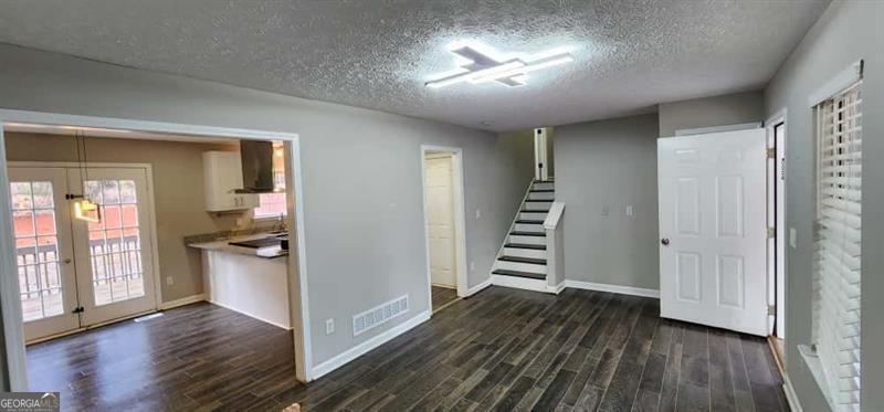 4872 Lewis Road Powder Springs, GA 30127 - Photo 9 of 42 a view of a room with wooden floor closet and windows