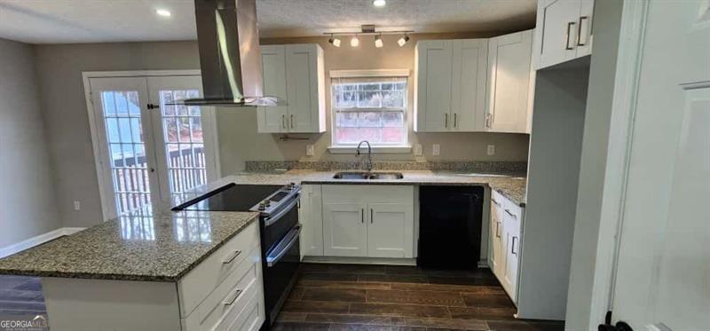 4872 Lewis Road Powder Springs, GA 30127 - Photo 10 of 42 a kitchen with a sink stove and cabinets
