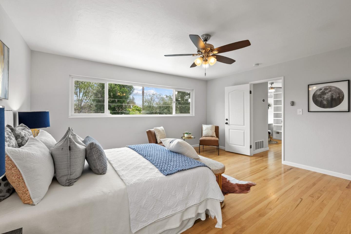 1130 Polk Lane San Jose, CA 95117 - Photo 25 of 47 a bedroom with a large bed and a chandelier