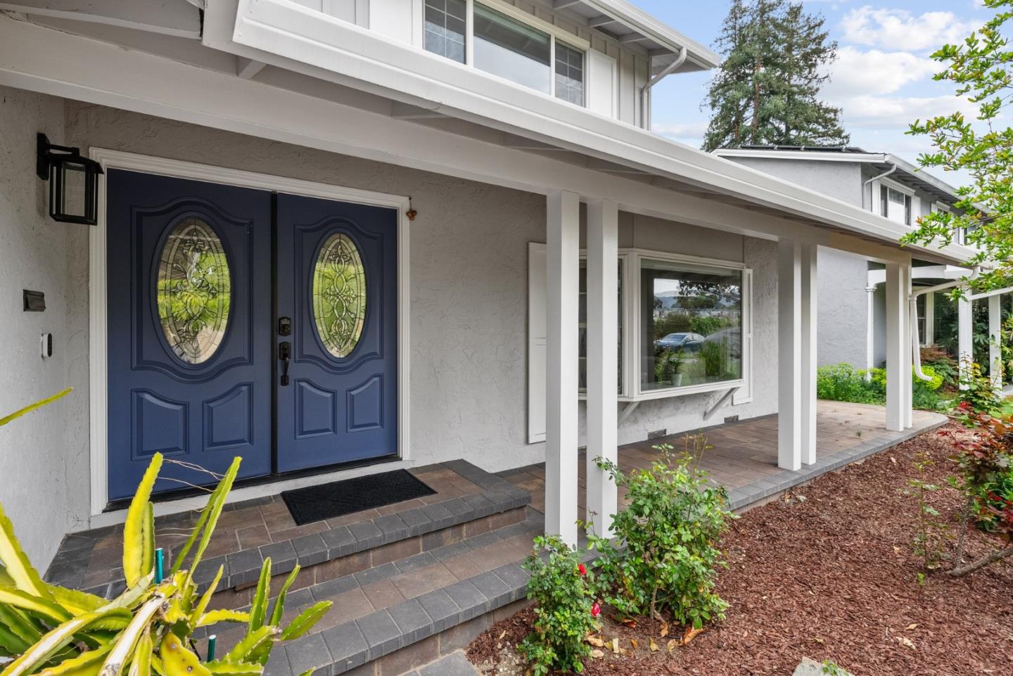 1130 Polk Lane San Jose, CA 95117 - Photo 5 of 47 a view of a house with large window and a wooden fence